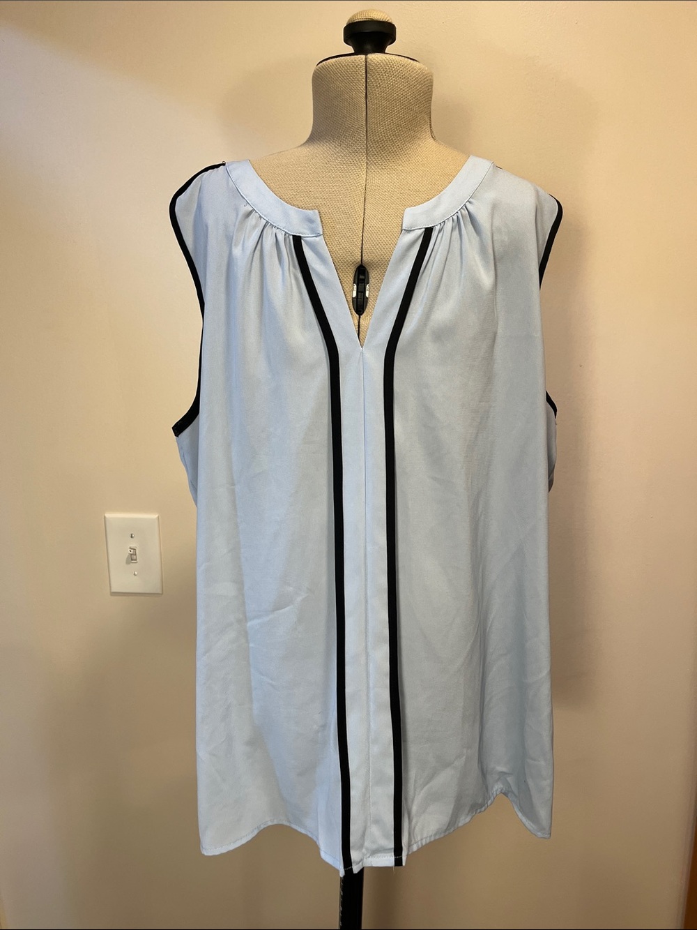 Light Blue Sleeveless V-Neck Top with Black Trim